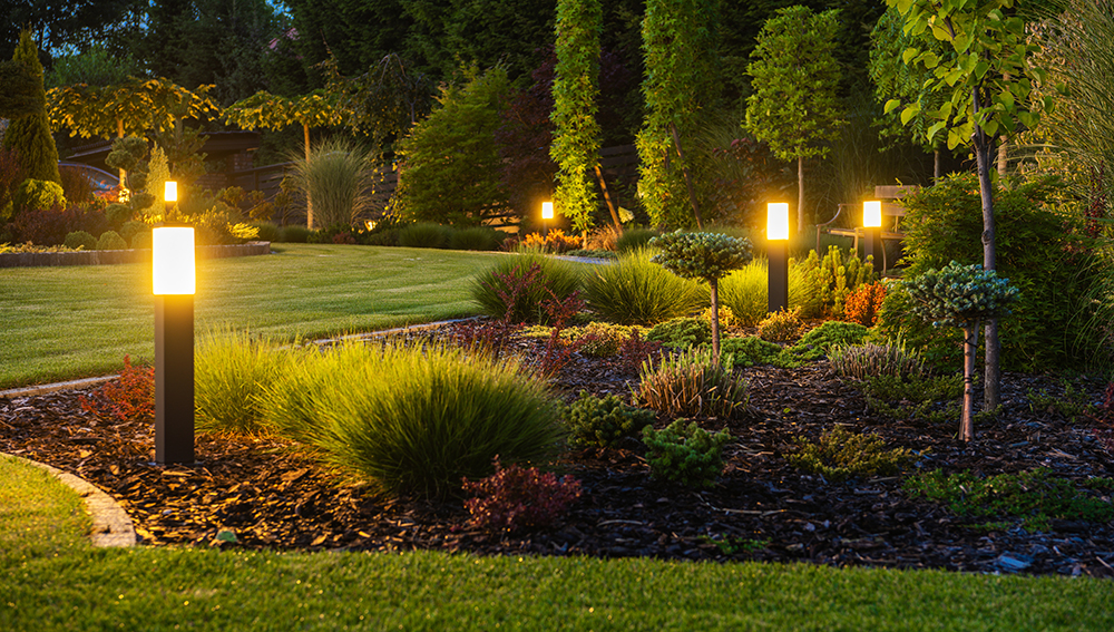 panoramic photo led light posts illuminated backyard garden night hours modern backyard outdoor lighting systems