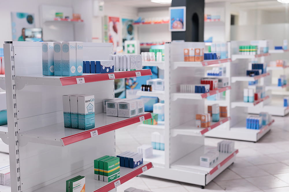 empty drugstore with bottles packages full with medicaments retail shop shelves with pharmaceutical products pharmacy space filled with medical drugs pills vitamins boxes